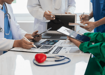 Doctors and administrators reviewing medical content during a training session